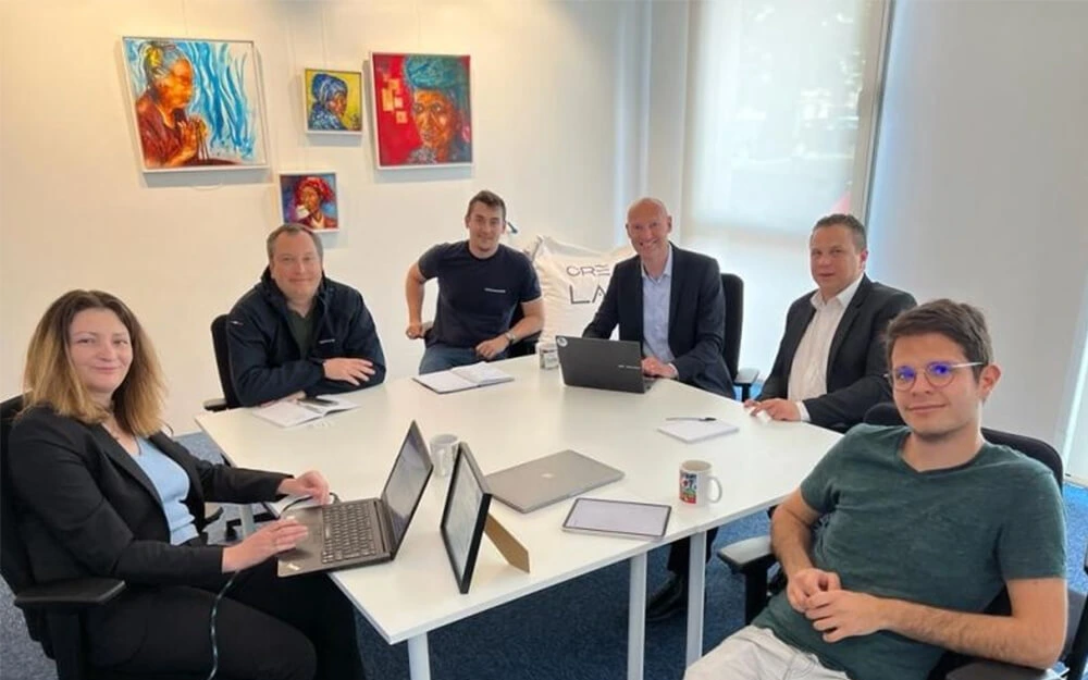 FROGCAST team and partners around a conference table discussing meteorological solutions for agricultural pesticide spraying optimization.