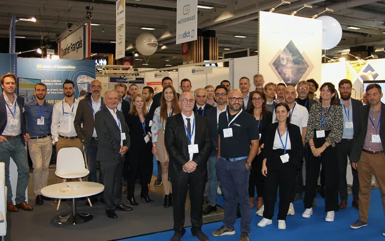 FROGCAST team with industry leaders at a trade event celebrating joining Prométéo