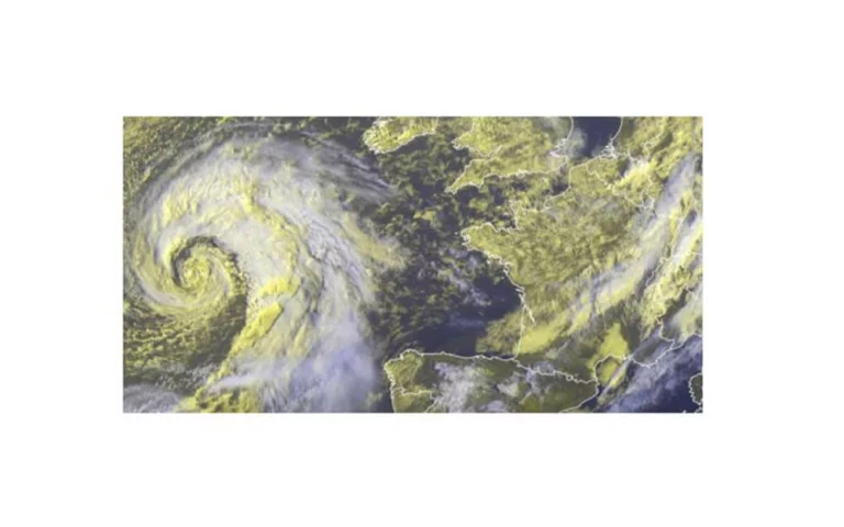 Satellite view of deep 973 hPa low-pressure system with spiral approaching French Channel coast